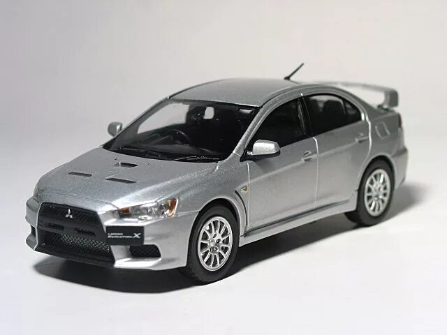 Модель 1 10 купить. 1:43 Mitsubishi Lancer EVO X. Моделька Mitsubishi Lancer 10. Мицубиси Лансер 10 модель. Митсубиши Лансер 10 1:43.