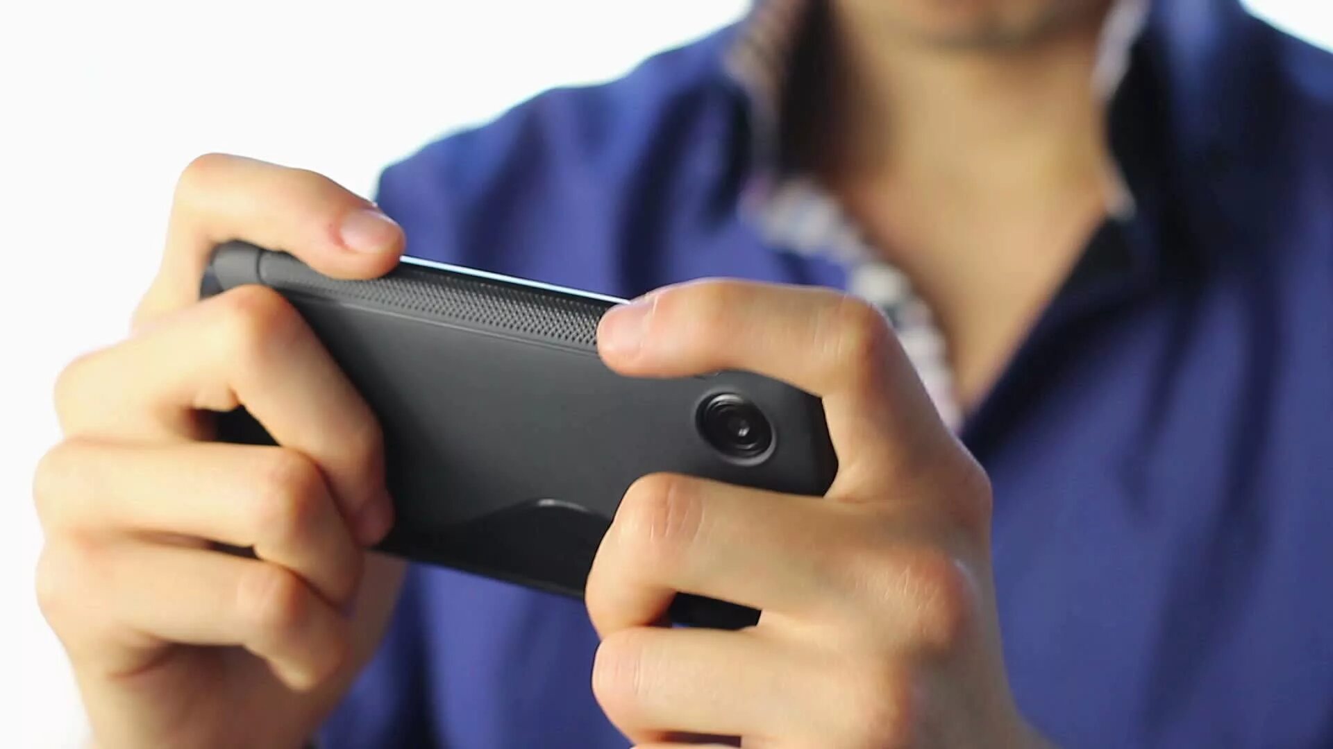 Playing mobile. Play games on the phone. playing games on smartphone. playing mobile phone games. man gaming on smartphone.