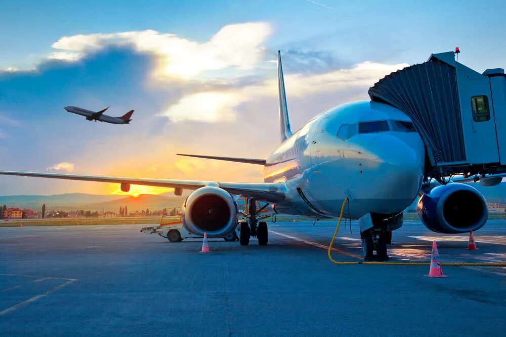 Positive points of cheaper air travel. Flight booking. самолёт приземляется на закате. Cheap flights. Flight number.