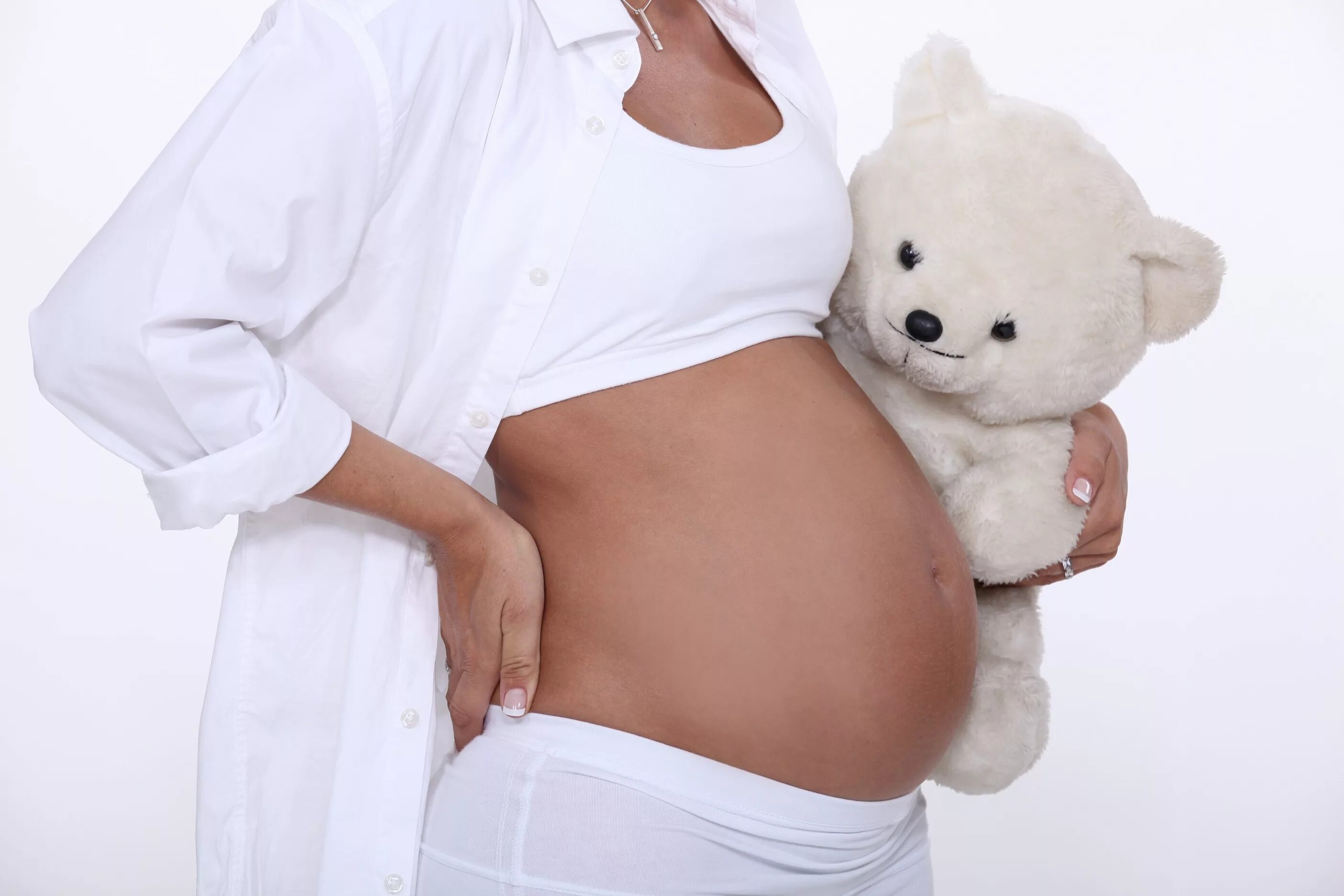 Красивый беременный живот. Беременный живот. Животики беременных. Фото живота беременной. Фотосессия беременной с небольшим животом.