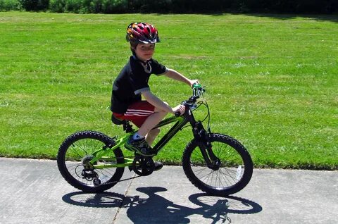 He s riding a bike