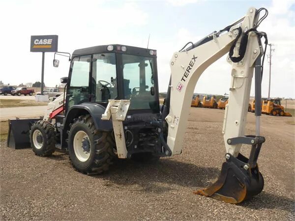 Экскаватор погрузчик 825. Terex TLB 840. Экскаватор-погрузчик Terex tlb840sm. Экс погрузчик Terex TLB 990 PM. Трактор Terex 840.