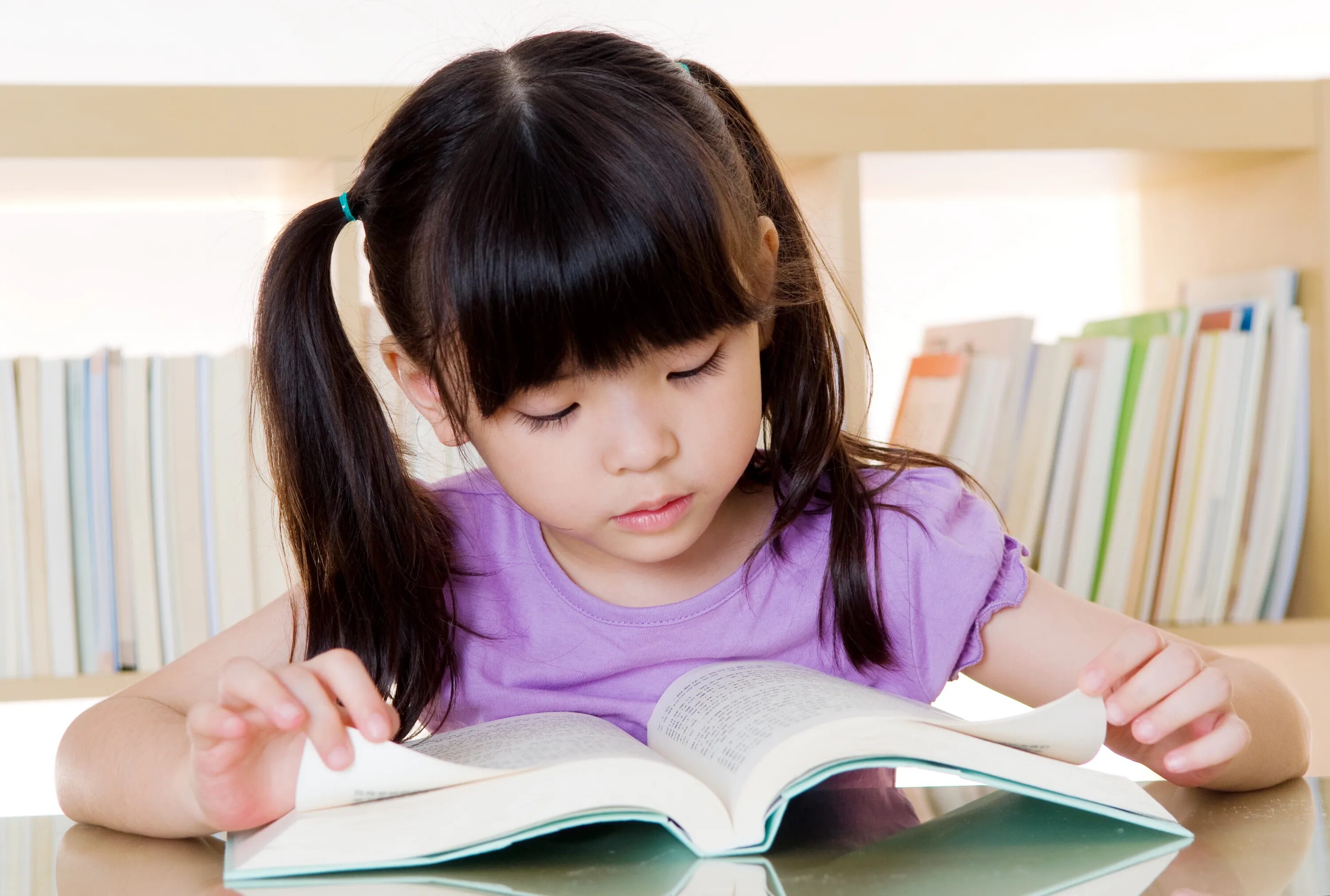 She is learning to read