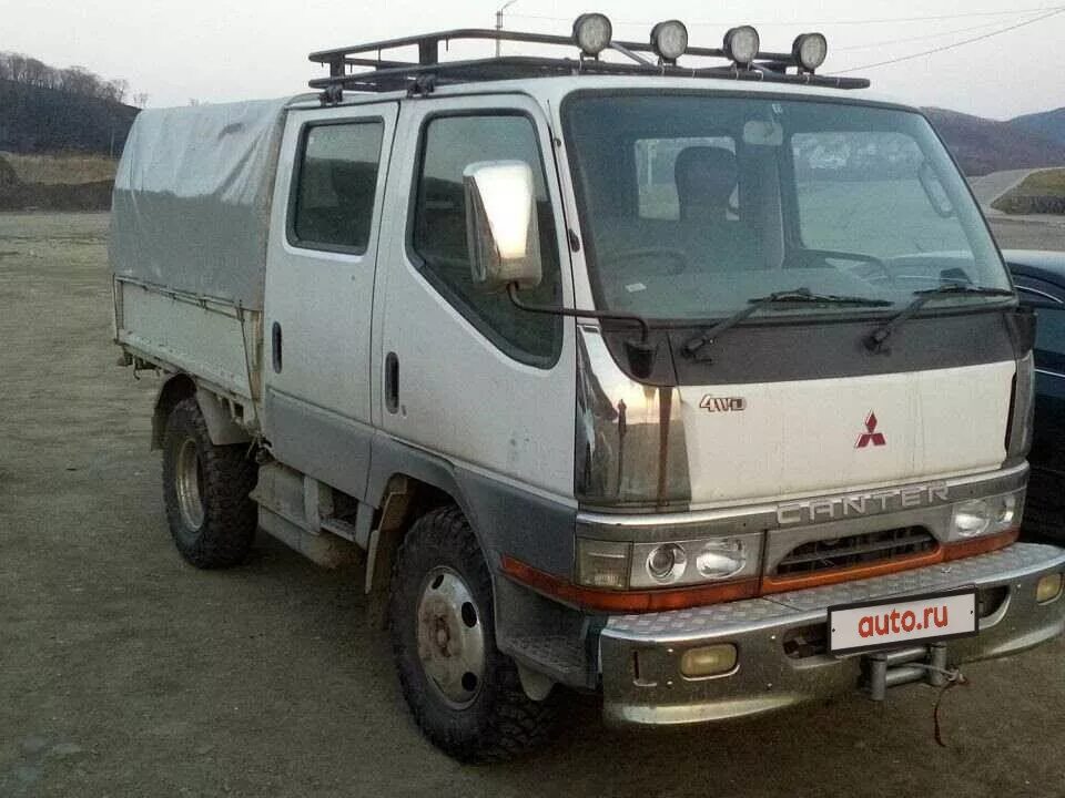 Купить митсубиси кантер бу. Mitsubishi Canter 1997. Mitsubishi Canter 4wd. Mitsubishi Fuso Canter 1997. Митсубиси Кантер двухкабинник 4х4.