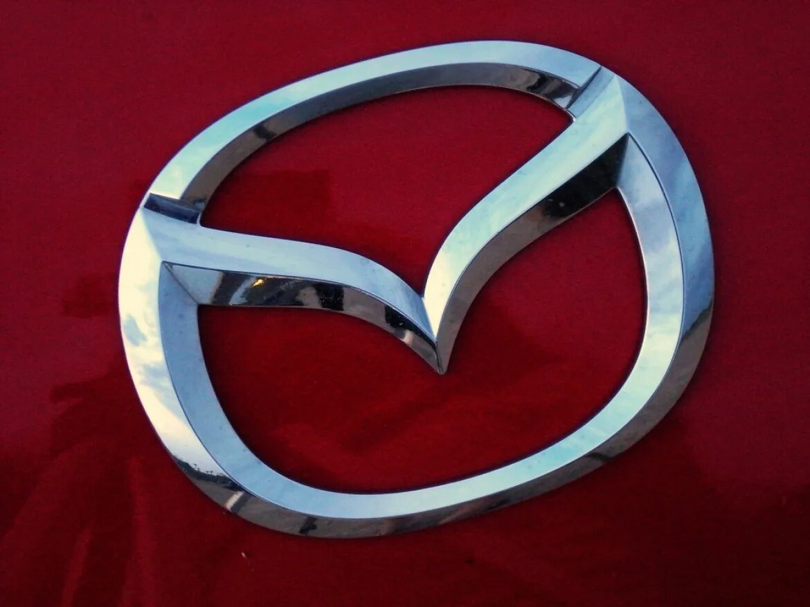 Mazda знак. Марка машины Мазда. Mazda эмблема. Мазда символ. Знак мазды 6.
