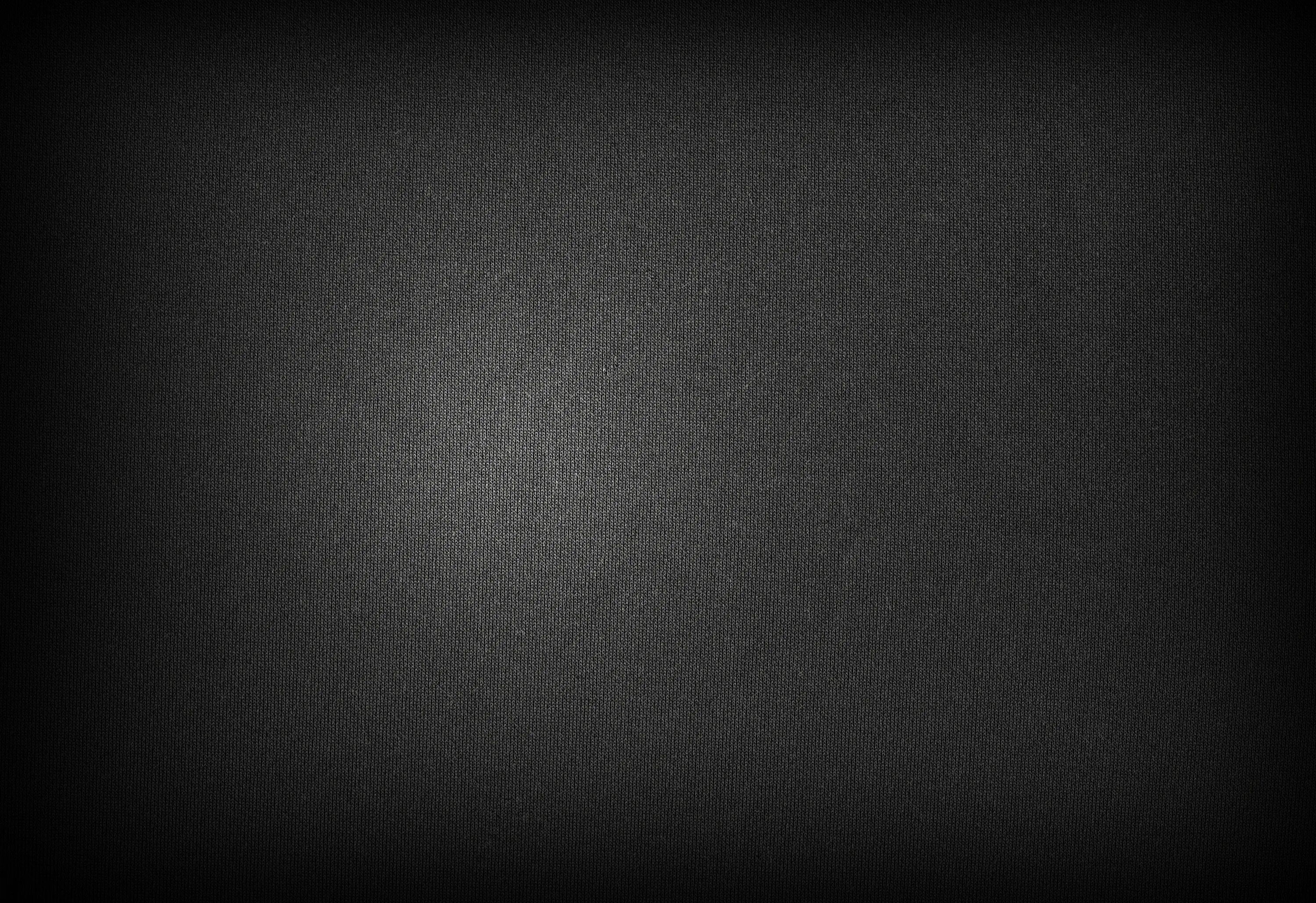 Темно серый фон. Черная матовая ткань. Черная текстура. Черная матовая текстура.