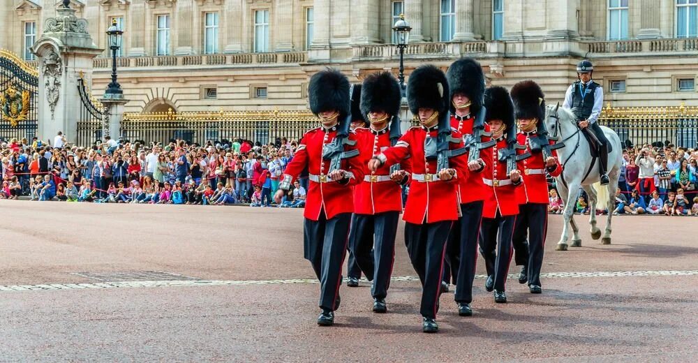 The changing of the guard takes place. Buckingham palace guards. buckingham palace changing of the guard. buckingham palace london change of guards. a guard at the buckingham palace.
