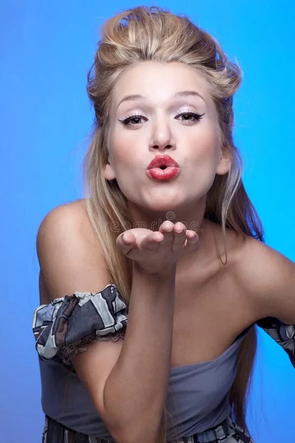 Blowing a kiss