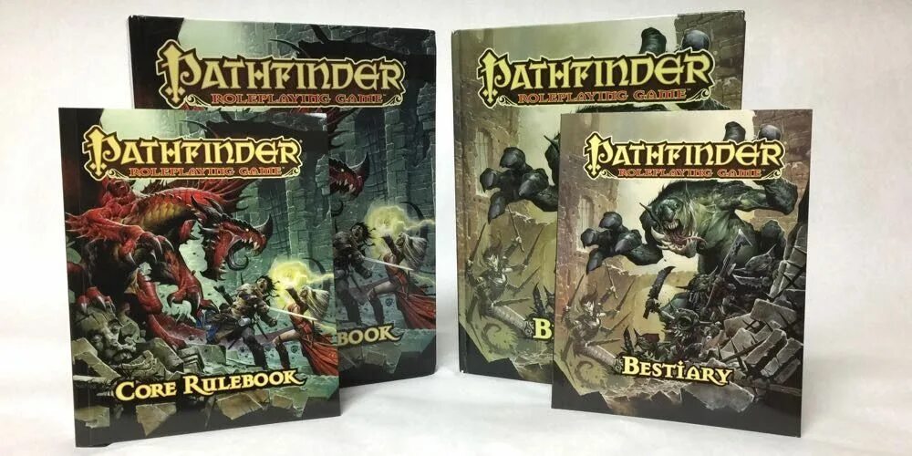 Следопыт книга 2. Pathfinder 2 Core book. Pathfinder Rulebook. Pathfinder Edition. Бестиарий Pathfinder 2.