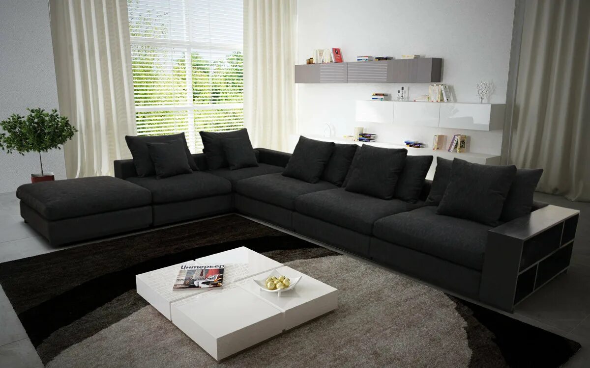 Большие диваны фото. Серый модульный диван в интерьере. Длинный диван в гостиную. Большой черный диван. Темный диван угловой в гостиной.