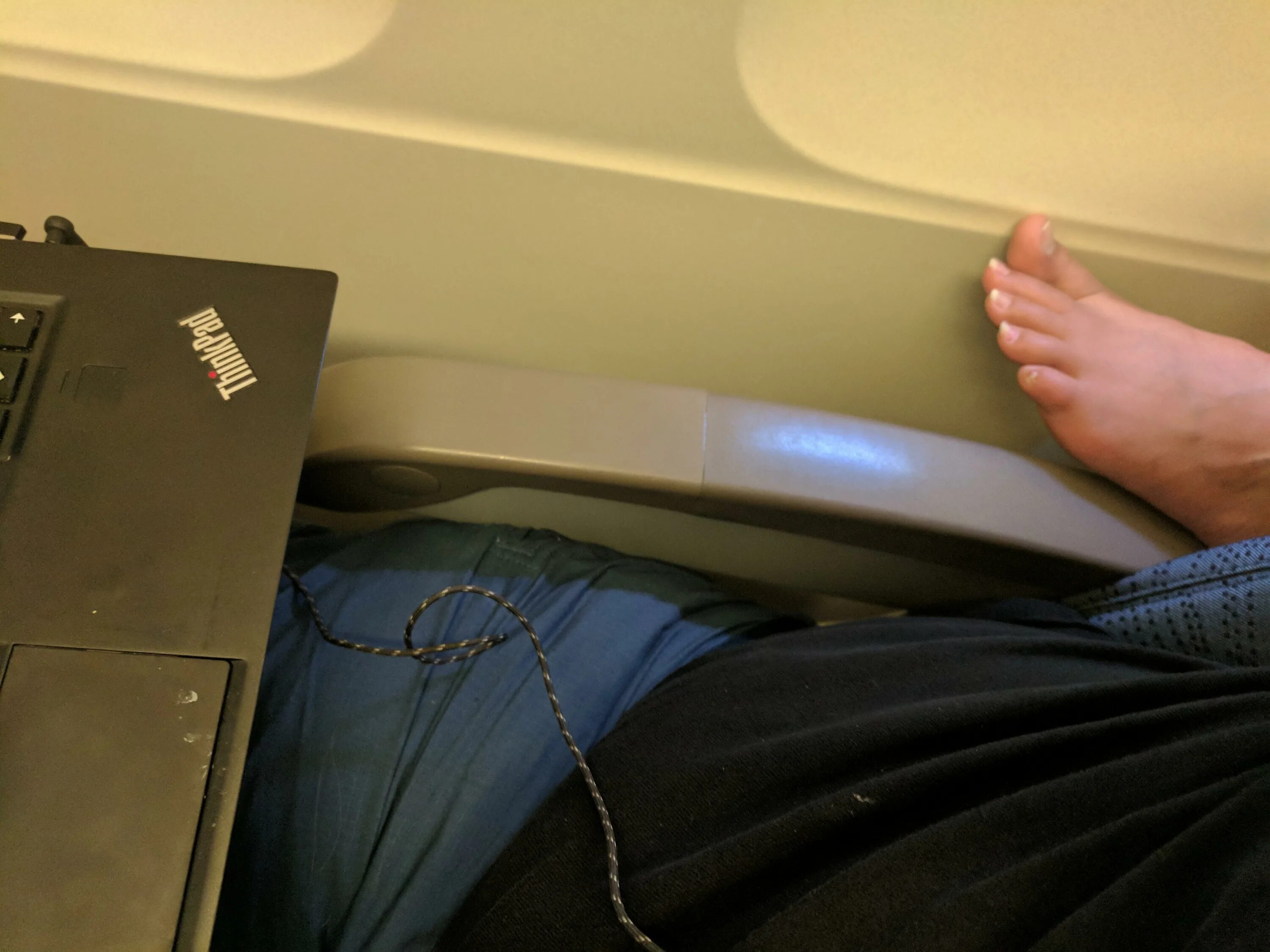 Feet on Airplane. Feet in plane. Barefoot on Airplane. Feet in Airplane.