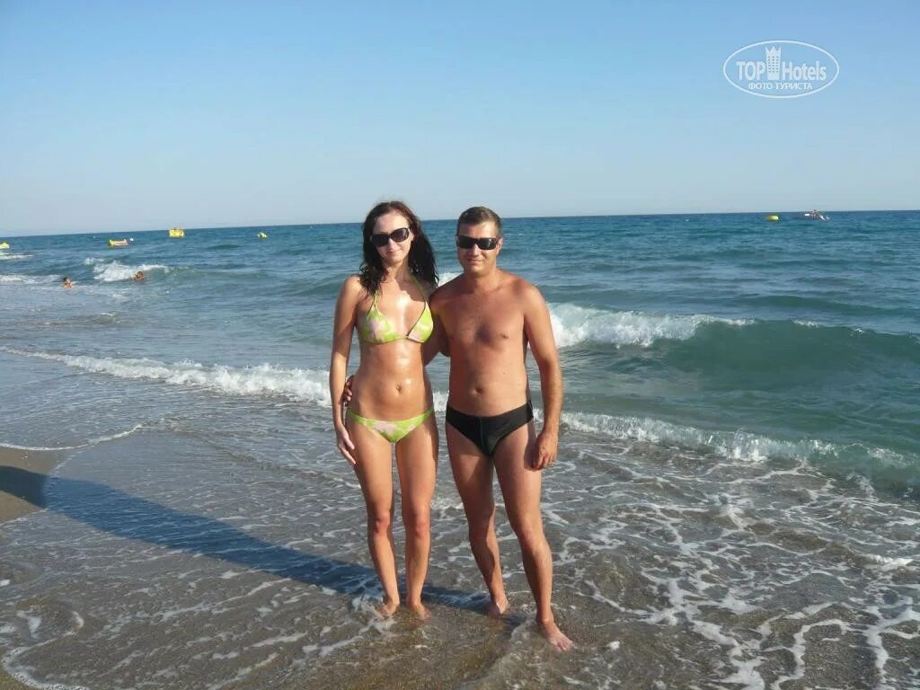 Antalya Resort Beach with Sun Loungers, Berth, and Sunbathers Pe Editorial Stock