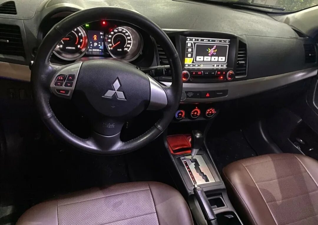 Mitsubishi lancer 2012. Мицубиси Лансер 2012 салон. Митсубиси Лансер 2012 салон. Mitsubishi Lancer 2012 салон. Мицубиси Лансер 2012г.