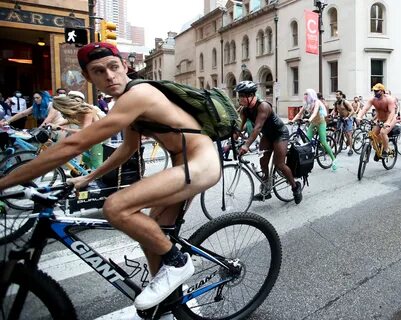 People ride bikes around Rittenhouse Square in Philadelphia during the Phil...