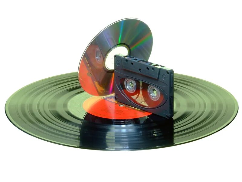 Аудиокассеты и компакт диски. Коллаж из кассет дисков и дискет. Пластинки кассеты диски катушки. Кассеты сборники. Старые диски и кассеты.