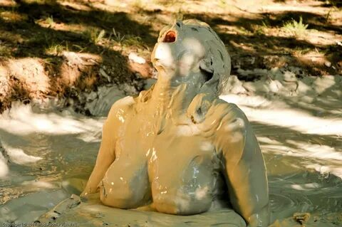 Naked mud bath.