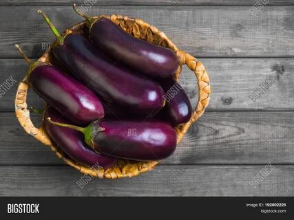 Download high-quality Fresh raw Purple Eggplant special wicker basket image...