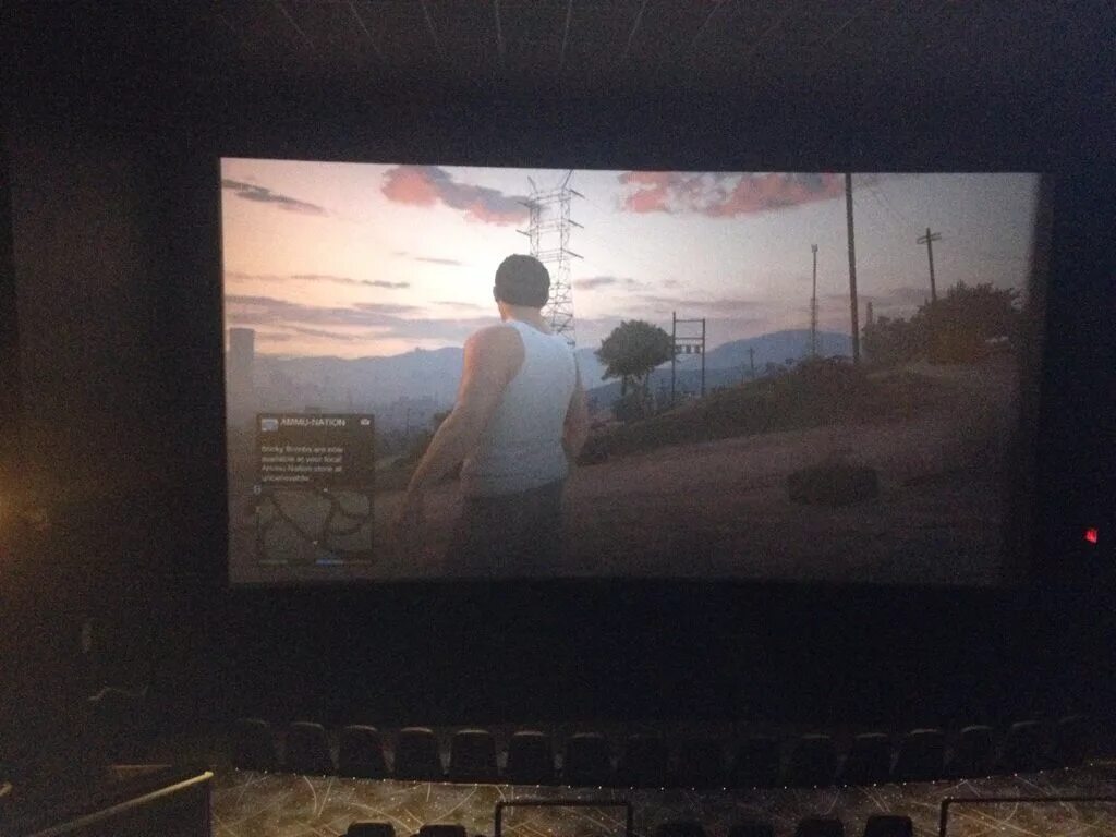 They play the game when. The big screen. игра в кинотеатре на большом экране. смешной экран на приставку.