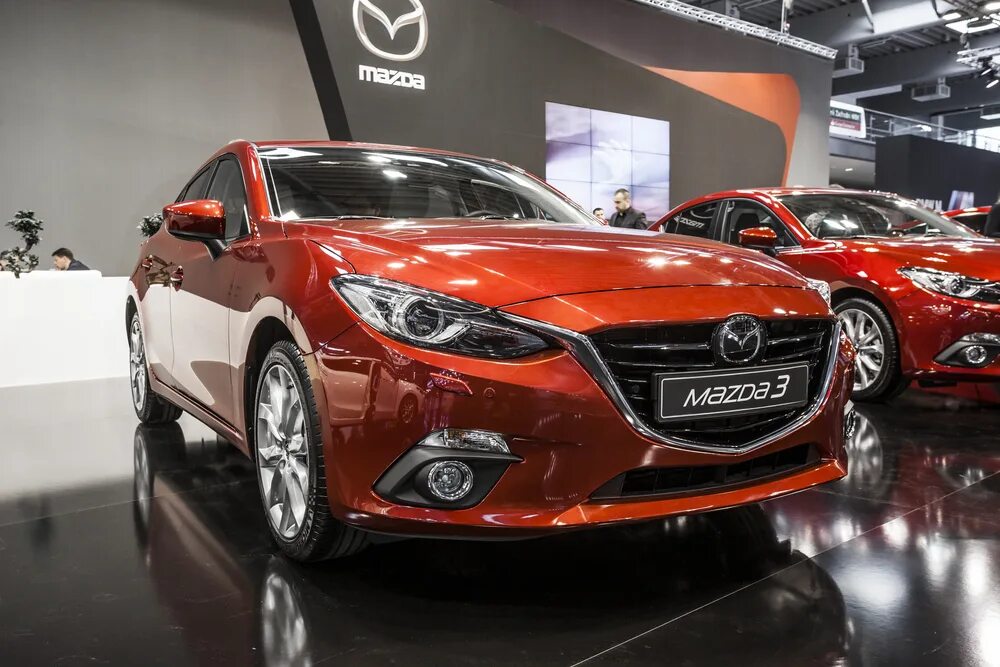 Mazda sky. Мазда 10. Мазда 3 оранжевая. Концерн Мазда. Оранжевая Мазда СХ.