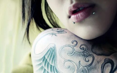 Girl getting tattoo