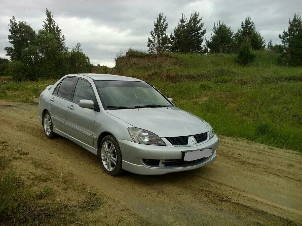 Купить лансер 9 механика. Mitsubishi Lancer IX 2.0. Мицубиси Лансер 9 серебристый. Lancer 9 2.0 серебристый. Lancer 2.0 2004.