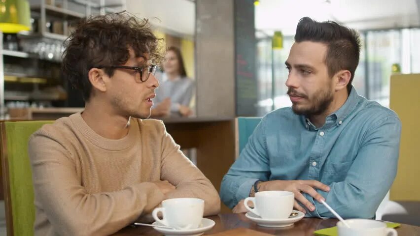 Two young men. Man talking. 2 Men talking. Man talking in Camera. Man talking in cam.