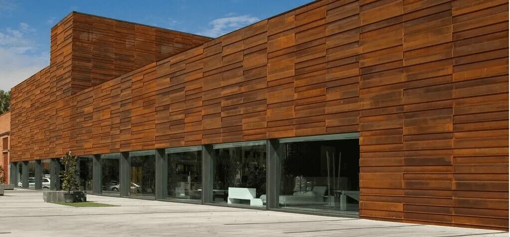 Фасады зданий из стали. Фасады зданий из стали. Перфорированные панели в архитектуре. Фасад здания с металл перфорированный. Кортеновская сталь фасады.