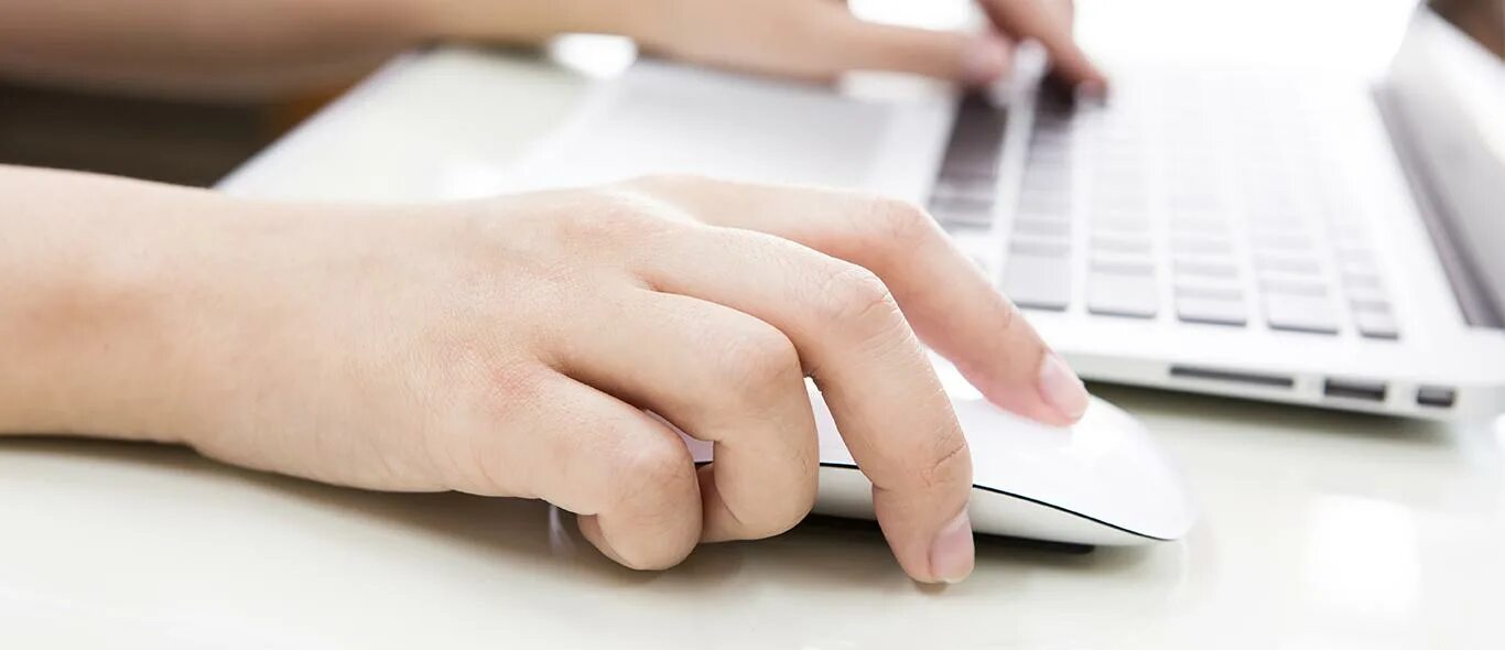 Hand typing on Laptop narrow picture. Пишет рука рядом с мышкой затемненная картинка. Internet job ideas. Two handed typing. Https consumer 1