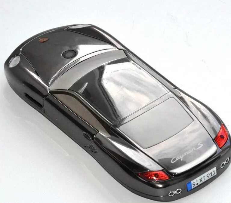 Порше кайман 2023. Porsche mobile. Кнопочный телефон porsche. Porsche mobile. Кнопочный телефон porsche design.
