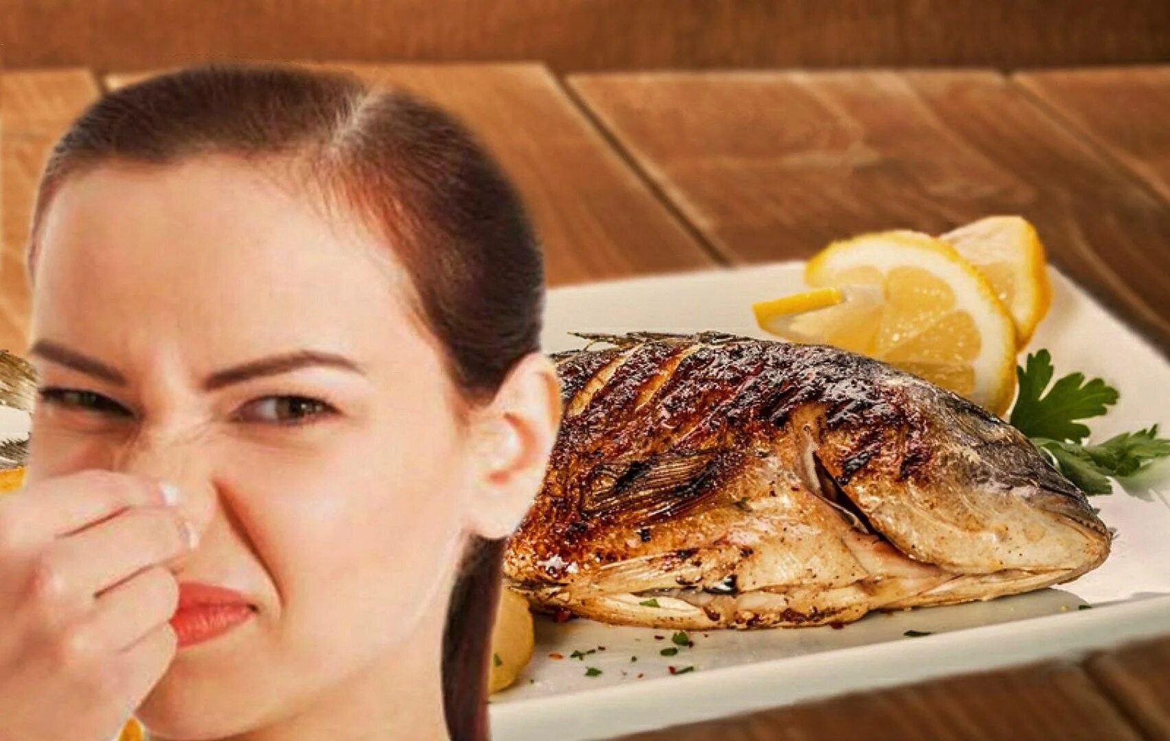 Воняет на кухне. Женщина ест рыбу. Запах рыбы. Женщина готовит рыбу.