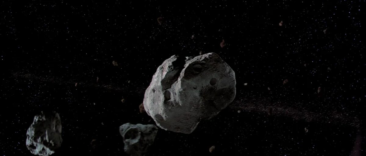 Астероидов пролетел мимо астероида. Астероид ve68. пояс астероидов. астероид гиф. астероиды анимация.