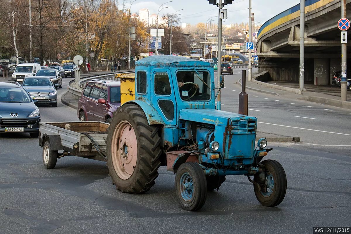 Тракторный 40. Т-40 (трактор). Трактор т-40 ЛТЗ. ЛТЗ-40 трактор. Трактор т-40 ам с телегой.