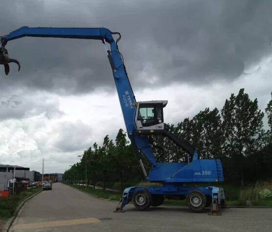 Перегружатели fuchs. Фукс 350 перегружатель. fuchs mhl 350. fuchs mhl 340. фукс 350 +переключатель glr mode fuchs mhl 350 mm.