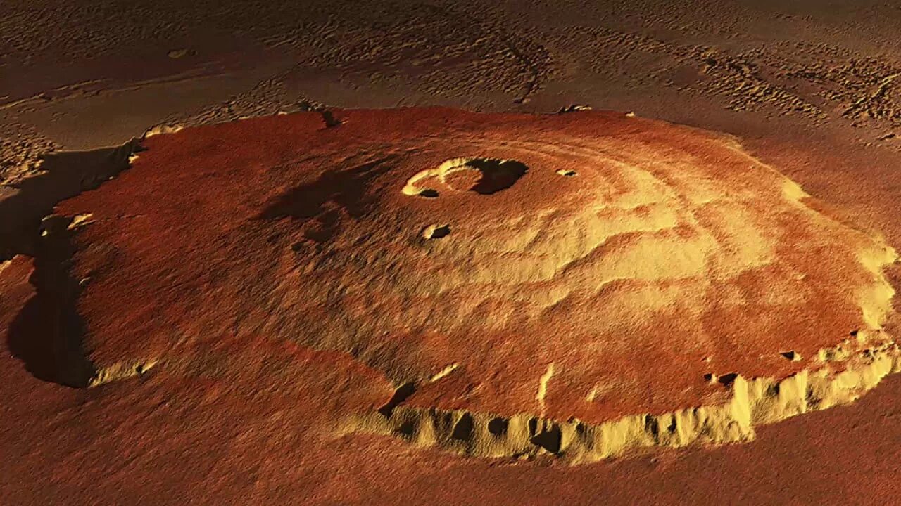 Самый большой вулкан солнечной системы находится. Гора Олимп на Марсе. Марсианский потухший вулкан гора Олимп. Вулкан Олимпус Монс на Марсе. Марс Планета гора Олимп.