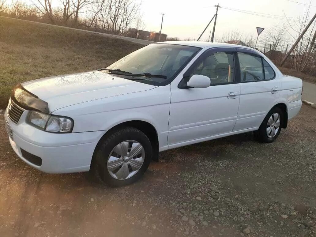 Купить ниссан санни в омске. Nissan Sunny b15 2003. Nissan Sunny b15 1.5 at. Ниссан Санни 2003 года. Ниссан Санни 2003 седан.