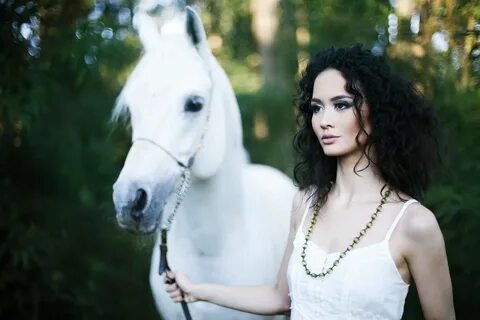 Asian. women. horse like mammal. stallion. photograph. horse. 