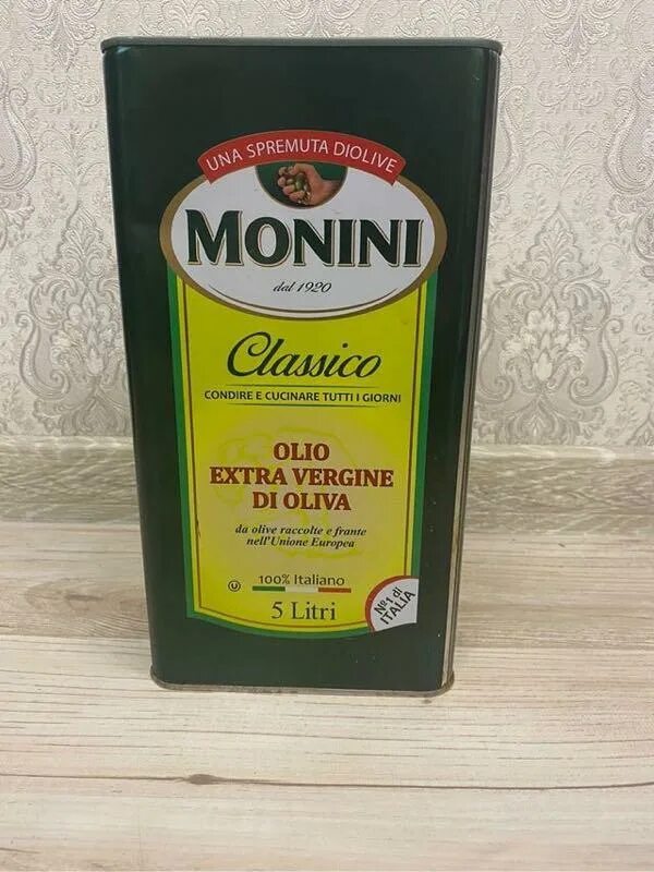 Масло оливковое monini classico extra. Масло оливковое Monini Classico Extra Virgin. Monini подставка. Масло Классико Экстра Вирджин 250мд. Хлопья в оливковом масле Monini.