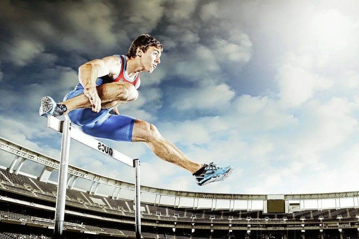 Виды спортсменов. Ральф Крейг легкоатлет. Прыжки через барьеры. Фотообои спортсмен. Профессиональный спорт победа.