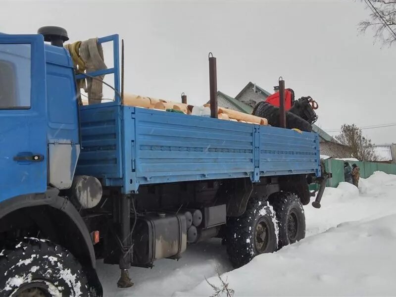 Эвакуатор лодейное поле. КАМАЗ вездеход с манипулятором.