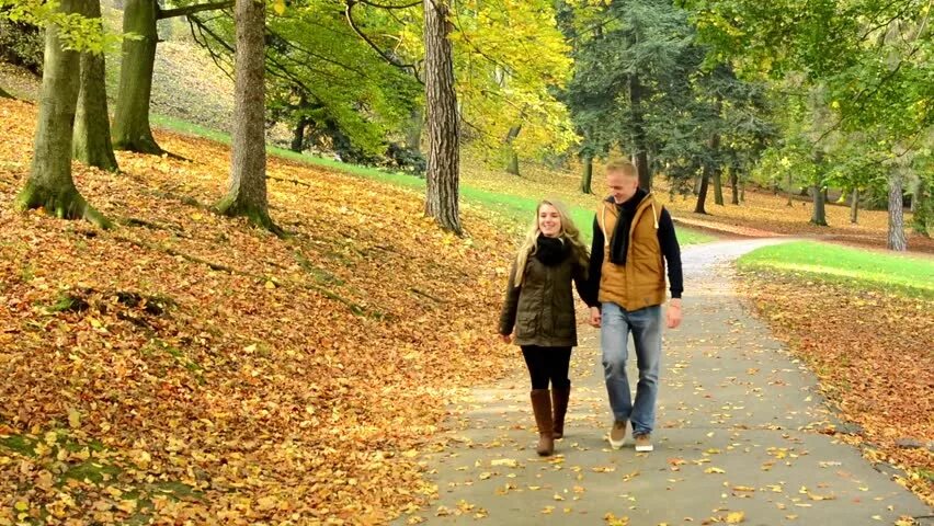 People Walking in the Park autumn. Cass Park and walk. I walk in the Park. Couple walk in Street autumn.