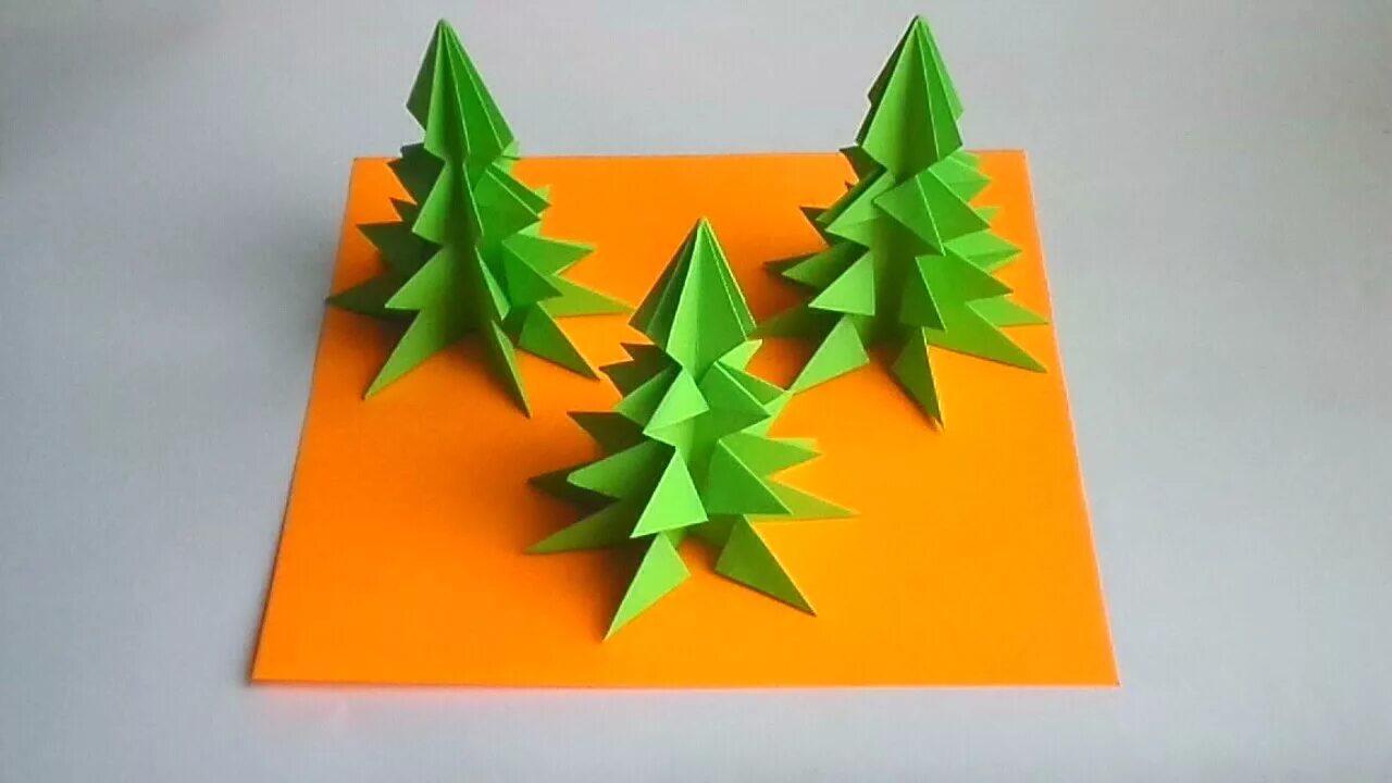 Оригами елочка. Оригами Новогодняя елка. Елочка оригами из бумаги. Новогодняя елочка оригами