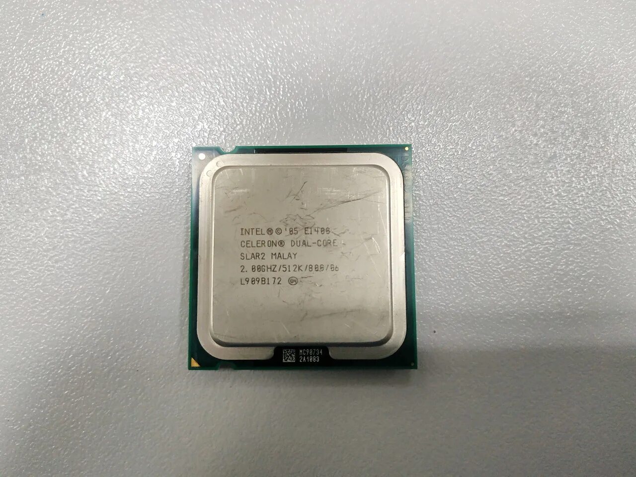 Intel 05 e1400. Intel Celeron e1400. E1400 Celeron vid. Интел 05 e1408 Celeron Dual Core slar2 malay2 00ghz /512k/800/86 l 848b730.