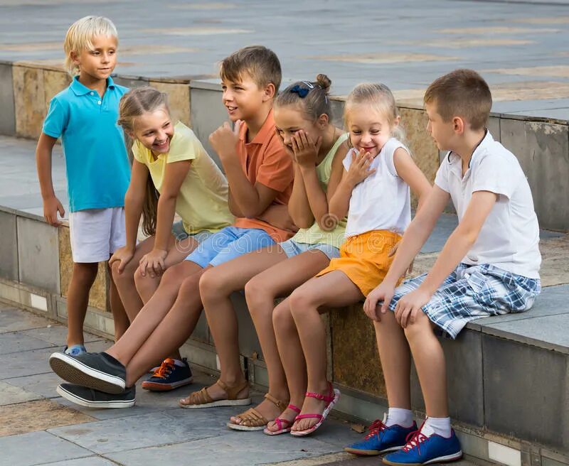 Spending time outside. Children spending time outside and playing charades.