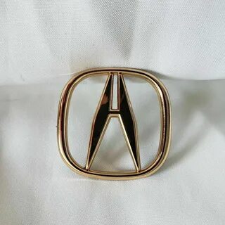 Акура значок