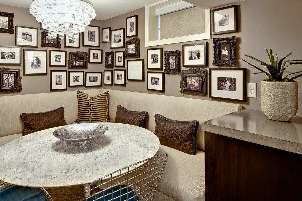 All the vintage black and white pictures on this wall have similar frames and wh
