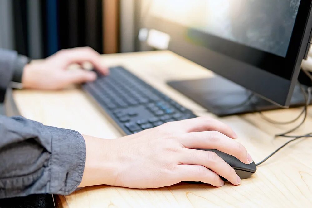 What you use computer for. Combating computer crime. computer mouse in hand.