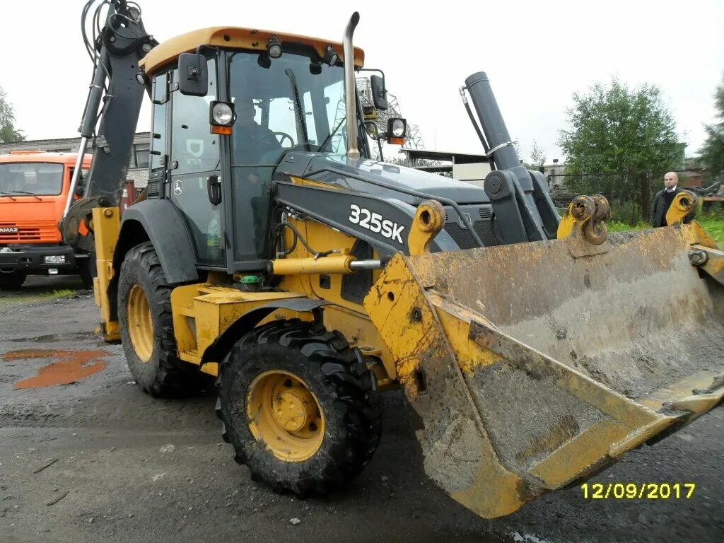 экскаватор погрузчик дир. экскаватор погрузчик дир. джон дир экскаватор погрузчик 325. John deere 325. экскаватор погрузчик джон дир 710.