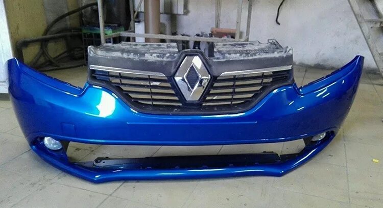 Бампер передний с отверстиями под птф на Renault Logan - 1 поколение - Запчасти 