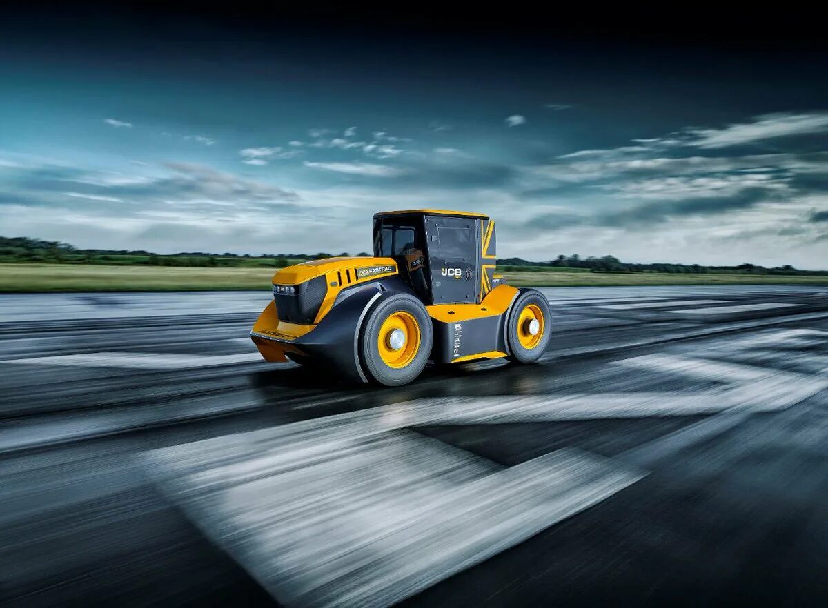 Трактор быстро едет. Jcb fastrac 8000. трактор jcb fastrac.