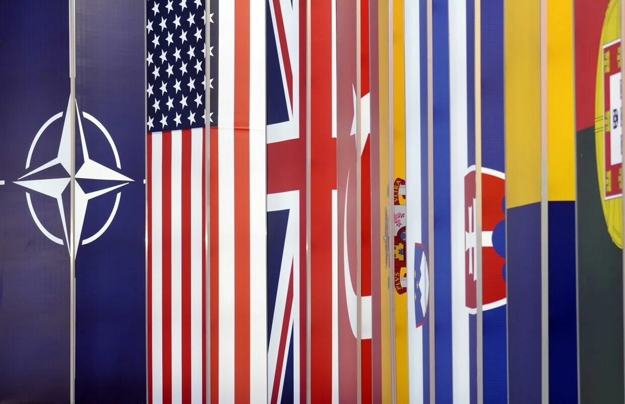 Участницы нато. Флаги стран участниц НАТО. Стоп НАТО. США НАТО. Флаги стран НАТО фото.